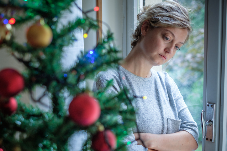 Woman feeling alone during christmas holiday - The Law Offices of Jane M. Randall, P.A. - Family Law, Family Mediation, Real Estate Attorney | in York County, Chester County, Lancaster County